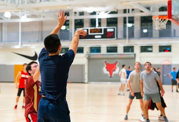 An image of students competing in intramural basketball.