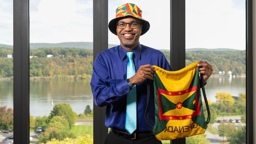 Image of Dr. Buckmire with Grenada apparel. 